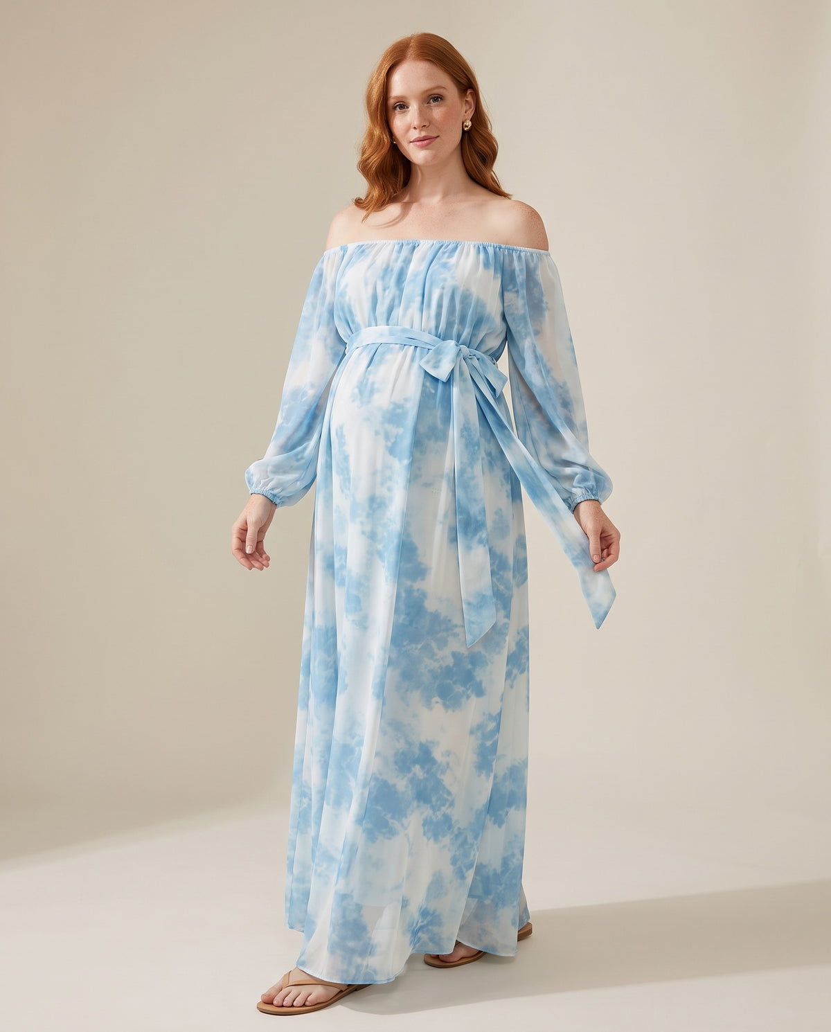 Blue tie-dye chiffon off-shoulder maternity maxi dress with sash, designed for beach photoshoots.