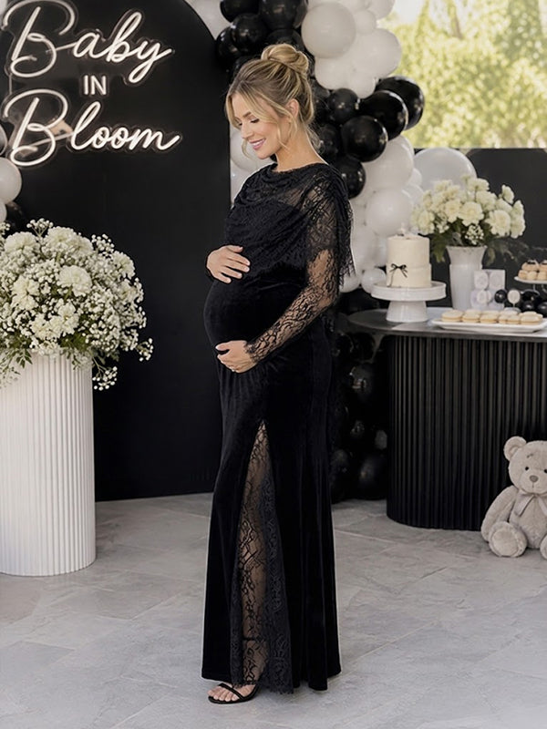 Side view of black velvet maternity maxi dress with lace cape overlay and lace sleeves, designed for baby shower.