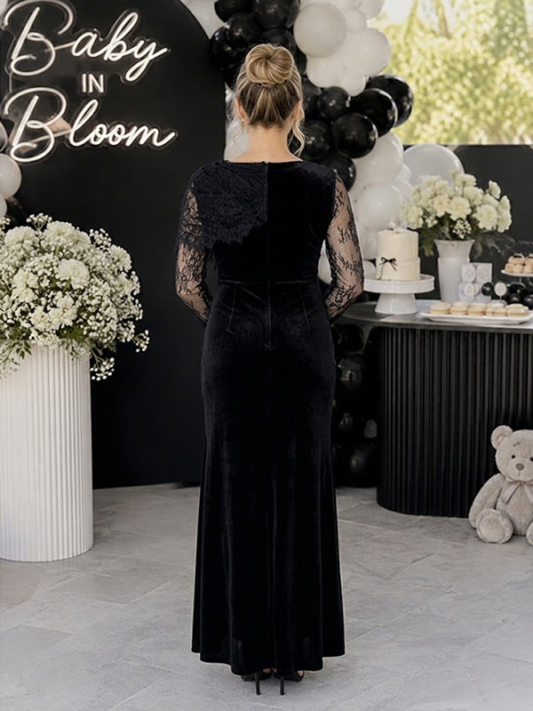 Back view of black velvet maternity maxi dress with lace cape overlay and lace sleeves, designed for baby shower.